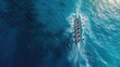 © buraratn - Aerial drone top ultra wide panoramic view of sport canoe rowing synchronous team of athletes competing in deep blue sea