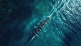 Aerial drone top ultra wide panoramic view of sport canoe rowing synchronous team of athletes competing in deep blue sea