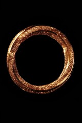 Poster - A simple and elegant gold ring placed on a solid black background. Ideal for jewelry advertisements or showcasing the beauty of the ring.
