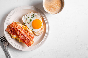 Wall Mural - Breakfast sandwiches with fried egg, bacon and scrumble