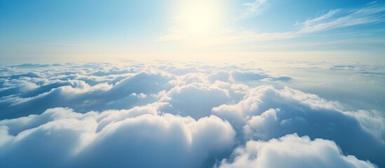 Wall Mural - Aerial Cloudscape: Flying Above Sunny City on a Brilliant Day