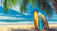 Surfboards On The Tropical Beach By The Ocean With Palm Tree, Summer Wallpaper Background. Travel, Adventure And Water Sports. Colorful Surfboards Lined Up On A Sunny Sandy Beach With Palm Trees.