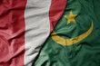 big waving national colorful flag of mauritania and national flag of peru .