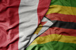 big waving national colorful flag of zimbabwe and national flag of peru .