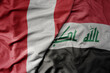 big waving national colorful flag of iraq and national flag of peru .