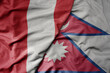 big waving national colorful flag of nepal and national flag of peru .