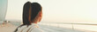 © Andrii Nekrasov - Close up, asian girl in sportswear stands at morning time on the sea background, Back view, Panorama