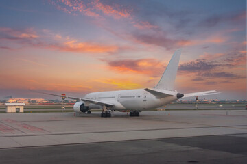 Wall Mural - Airliners jet plane rear view of the wings and tail during a bright dawn of beautiful sky.