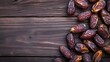 Dates fruit on wooden background. Top view with copy space.