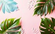 Creative layout made of tropical leaves on pastel pink and blue background