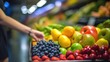 hand hold supermarket shopping cart with abstract blur organic fresh fruits and vegetable on shelves in grocery store defocused bokeh light background