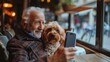Love, relax and retirement senior man with dog pet together in cafe taking selfie. Pet friendly space concept. Saving memories with pet. 