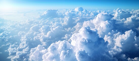 Wall Mural - White Clouds Dive Through the Vast Blue Sky in a Mesmerizing White Clouds, Blue Sky Scenery