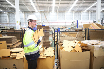 worker or engineer working in factory with safety uniform , safety hat and safety glasses , image is safety concept or happy workplace