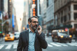 © Eva Corbella - elegant business man with talk to mobile phone crossing a street.