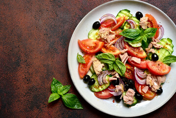 Wall Mural - Fresh vegetable salad with tuna. Top view with copy space.