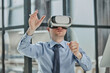 © Katsiaryna - businessman in virtual reality headset in the office