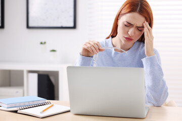 Sticker - Woman with glasses suffering from headache at workplace in office, space for text