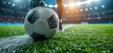 Fototapeta Sport - After game. Closeup soccer ball on grass of football field at crowded stadium