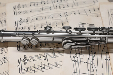 Sticker - Classical flute on sheets with musical notes, closeup