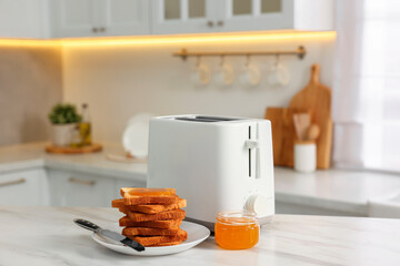 Wall Mural - Breakfast served in kitchen. Toaster, crunchy bread and honey on white marble table