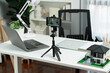 All equipment sets for architecture recording by smartphone standing on white desk consist of laptop, paper, model house and pencil for coaching host channel, live streaming at modern office. Gusher.