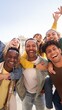 © CarlosBarquero - Vertical Portrait excited multi-ethnic group happy young friends piggyback enjoying great time outdoors and having fun together. Cheerful men carrying girlfriends on back Looking at camera on vacation