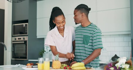 Wall Mural - Black couple, kitchen and breakfast in a home with love, smile and bonding together with food. Happy, support and marriage with trust and relax from cooking with juice and fruit in house at morning