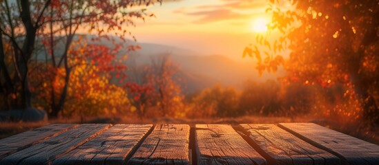 Sticker - Autumn Background with a Rustic Wooden Table Set against a Breathtaking Sunset, Evoking a Sense of Serene Autumn Time