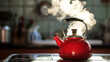 Red teapot steaming on the stove, copy space