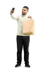 Canvas Print - A man, full-length, on a white background, with bags