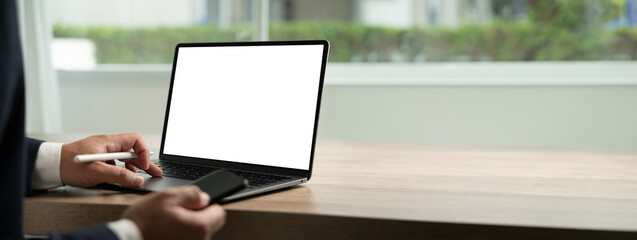Poster - young man working businessman using a desktop computer of the blank screen