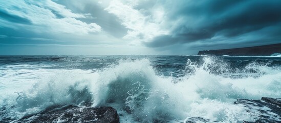 Wall Mural - View Above Waves Breaking on Rocky Coast