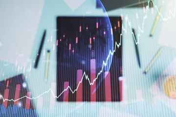 Poster - Multi exposure of abstract creative financial graph with world map and modern digital tablet on background, top view, forex and investment concept