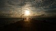 Beautiful Natural Scenery, Sunset Light With Silhouettes Of People At The End Of The Tanjung Ular Sea Pier, Indonesia