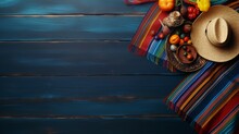 Cinematic Snapshot Of A Mexican Background With A Serape-striped Blanket, Sombrero, And Maracas On An Old Blue Wood Floor, Perfect For Capturing The Essence Of A Cinco De Mayo Festival.