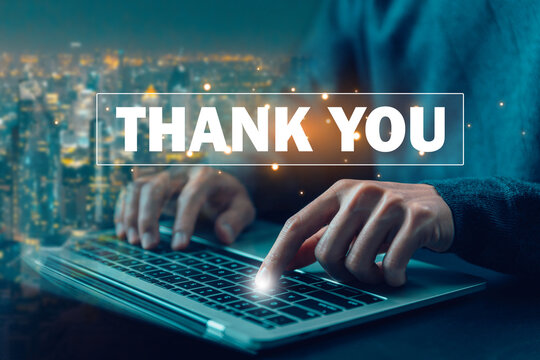 presentation from technology digital, a businessman using a laptop and showing the message thank you on a display screen. concept of congratulations, thank you in business, appreciation, and gratitude