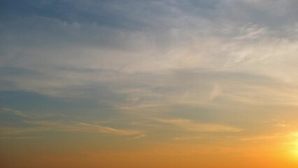 Wall Mural - 4K : Sunrise sky time lapse - Timelapse footage captures the vibrant colors of the sunrise sky, as golden hues blend with soft pinks and purples. Wisps of clouds dance gracefully.
