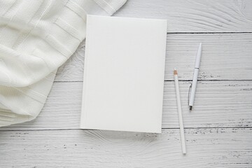 Canvas Print - White blank book with hard cover, mockup for planner, journal,  notebook cover design presentation, aesthetic styled stock photo.