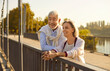 © Studio Romantic - Senior couple embraces the simple pleasures of life, taking a active walk through the city park. Their smiles radiate happiness, capturing the essence of an active and enjoyable vacation or holiday.