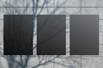 Poster - Creative outdoor tile wall with tree shadow and black mock up posters. Urban design concept. 3D Rendering.