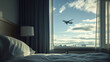 © 주현 이 - A hotel room airplane flying across the sky outside window in day time
