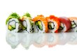 Traditional delicious fresh sushi roll set on a white background with reflection 