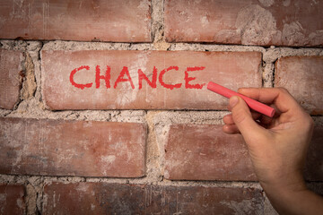 Wall Mural - chance. text written with purple chalk on a red brick background