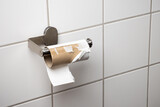 Fototapeta Miasto - Empty Toilet Paper Roll on a Bathroom Holder