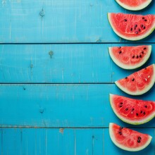 Watermelon Slices On Blue Wooden Background And Place For Text. 
