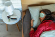Woman sleeping with sleep mask on face. Concept of sleep routine. Insomnia a sleep problems among adults.