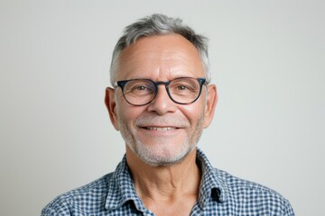 Aufkleber - A picture of a man wearing glasses and a plaid shirt. Suitable for business, casual, or everyday concepts