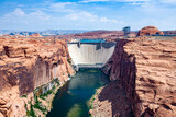Glen Canyon Dam at river colorado is delivering electricity by water turbine to the whole area