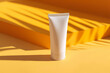 Leinwandbild Motiv Suncream sun lotion packaging mockup tube on a bright sunny background with tropical palmtree leaf